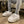  A pair of luxurious unisex slippers made from premium faux fur, local cotton, and wool, showcasing a rubber dot sole. The slippers are designed for both indoor and outdoor use, emphasizing their ultimate comfort with ultra plush foam. A promotional message offers 50% off the second pair with code HALFOFF.